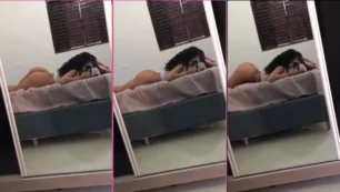 Mirian Gabriela, joven famosa de onlyfans, bailando frente al espejo mientras está acostada en la cama