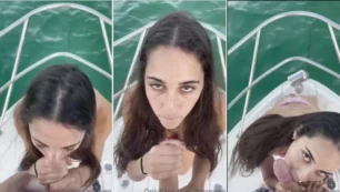 Durante el paseo en barco, la perra Izzy Green se agacha y empieza a jugar con el dueño del barco