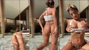 Shannonsinghof, una bella mujer de cabello oscuro posando junto a la piscina con sus braguitas ligeramente subidas