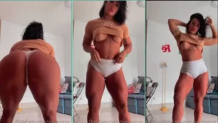 Sue Lasmar, en shorts ajustados, luce su gran culo mientras se masajea la parte superior del cuerpo